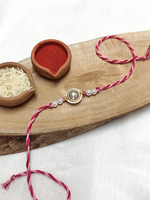White Kundan & Pearl with Pink Threads Bhai Rakhi