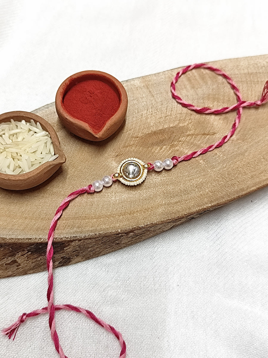 White Kundan & Pearl with Pink Threads Bhai Rakhi